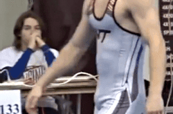 Wrestler Adjusting His Bulge