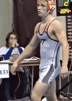 Wrestler Adjusting His Bulge
